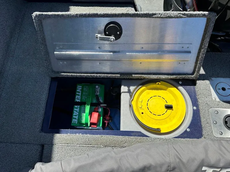 Slide: The Image of 2019 Tracker Pro Guide V-175 Combo battery compartment with Interstate battery and storage. - 15