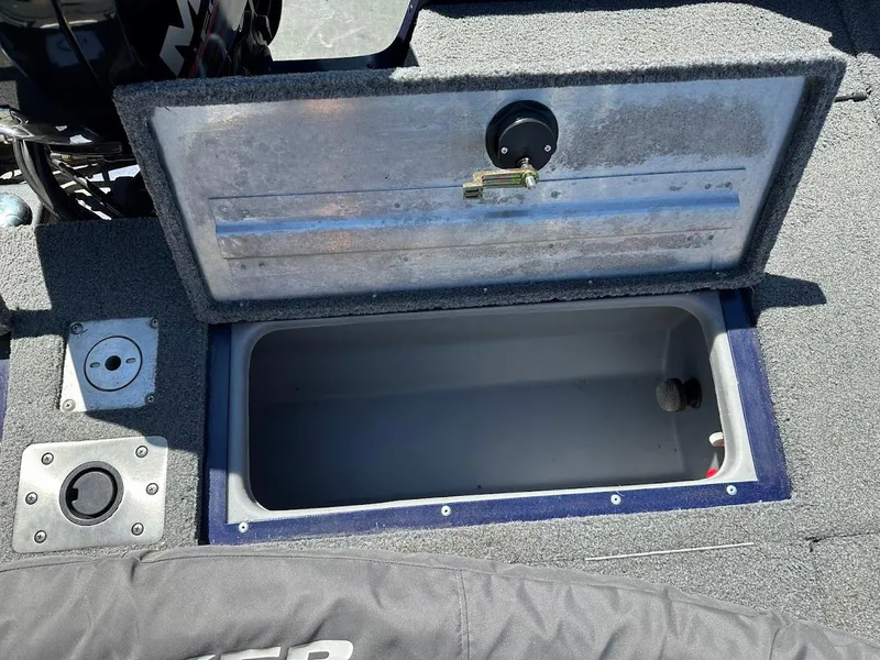 Slide: The Image of Open storage compartment on 2019 Tracker Pro Guide V-175 Combo boat. - 16