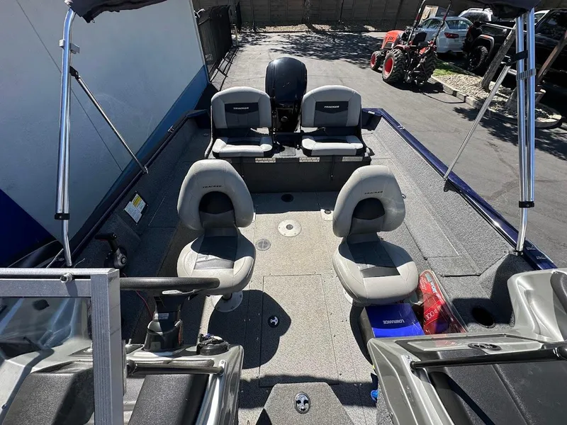Slide: The Image of 2019 Tracker Pro Guide V-175 Combo boat interior with seating and equipment. - 19