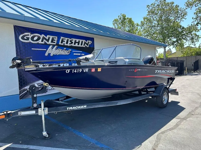 Slide: The Image of 2019 Tracker Pro Guide V-175 Combo boat on trailer at dealership. - 2