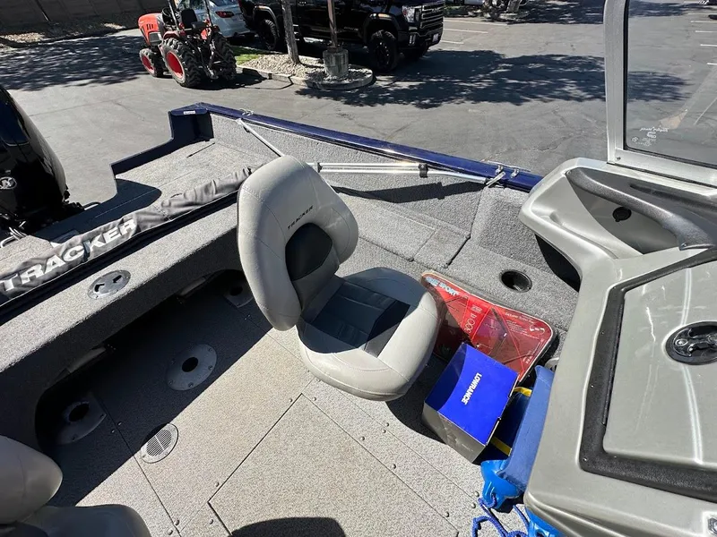 Slide: The Image of 2019 Tracker Pro Guide V-175 Combo boat interior with seating and storage compartments. - 22