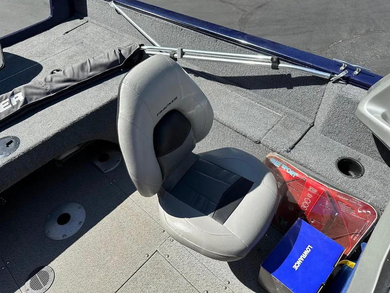 Slide: The Image of 2019 Tracker Pro Guide V-175 Combo boat interior with gray seat and accessories. - 23