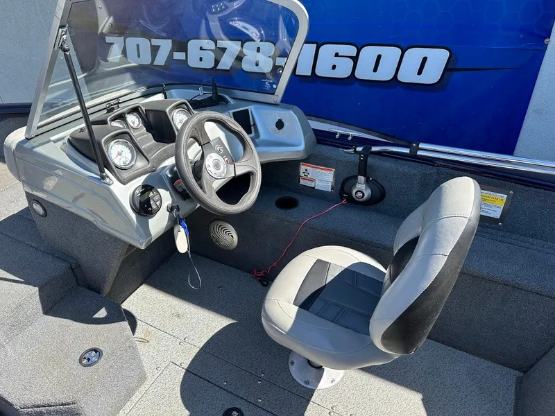 Slide: The Image of 2019 Tracker Pro Guide V-175 Combo boat interior with steering wheel and seat. - 24