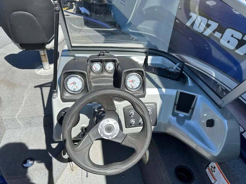 Slide: The Image of 2019 Tracker Pro Guide V-175 Combo boat dashboard with steering wheel and gauges. - 26