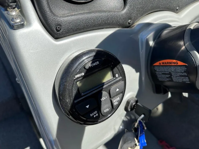 Slide: The Image of Control panel of 2019 Tracker Pro Guide V-175 Combo boat with warning label and keys. - 27