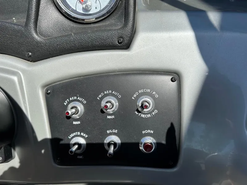 Slide: The Image of Control panel of 2019 Tracker Pro Guide V-175 Combo boat with switches and gauge. - 29