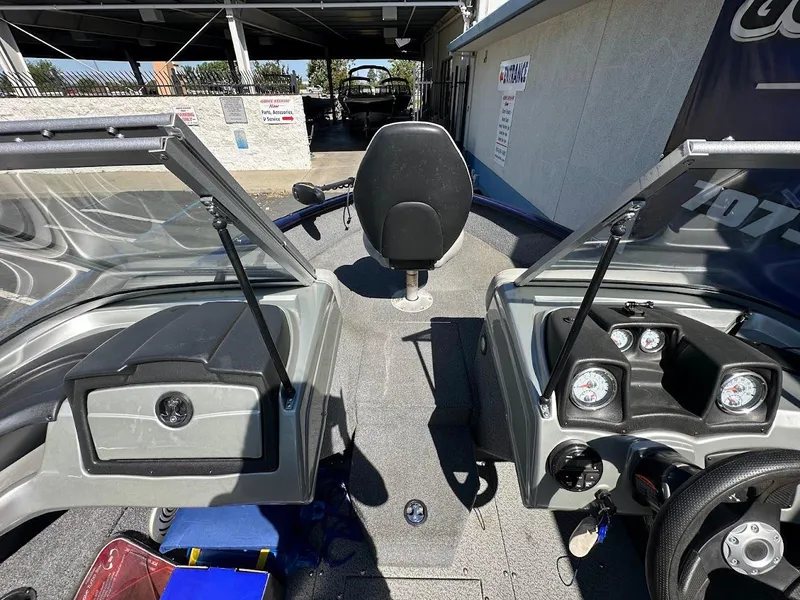 Slide: The Image of 2019 Tracker Pro Guide V-175 Combo boat interior with steering console and seating. - 30