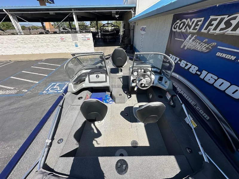 Slide: The Image of 2019 Tracker Pro Guide V-175 Combo boat interior with dual consoles and seating. - 9