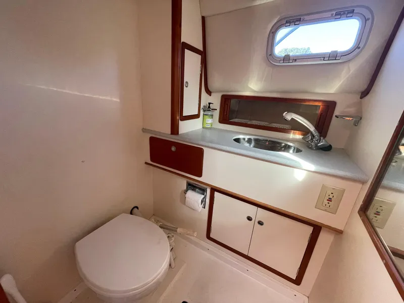 Slide: The Image of Bathroom interior of 1997 Little Harbor WhisperJet 36 yacht, featuring sink and toilet. - 10