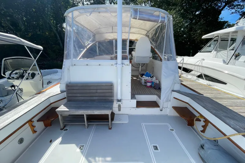 Slide: The Image of 1997 Little Harbor WhisperJet 36 boat interior with seating and helm station. - 17