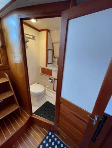 Slide: The Image of 1997 Little Harbor WhisperJet 36 yacht interior with wooden finish and compact bathroom. - 9