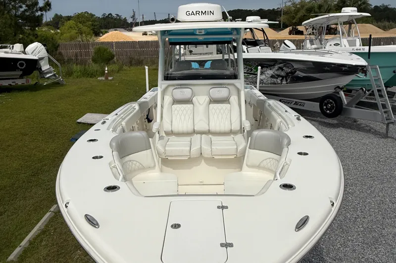 Slide: The Image of 2024 Key West 291 FS boat with Garmin equipment, displayed outdoors on gravel. - 10