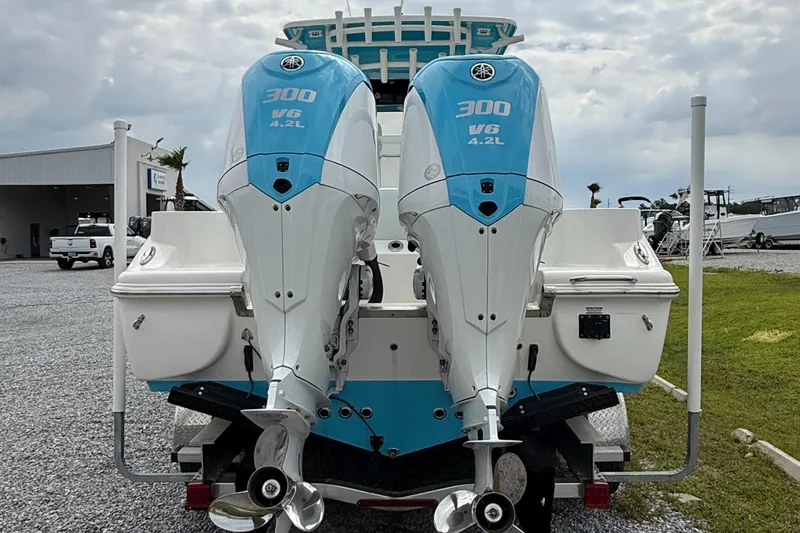 Slide: The Image of 2024 Key West 291 FS boat with twin 300 V6 4.2L engines, rear view. - 11