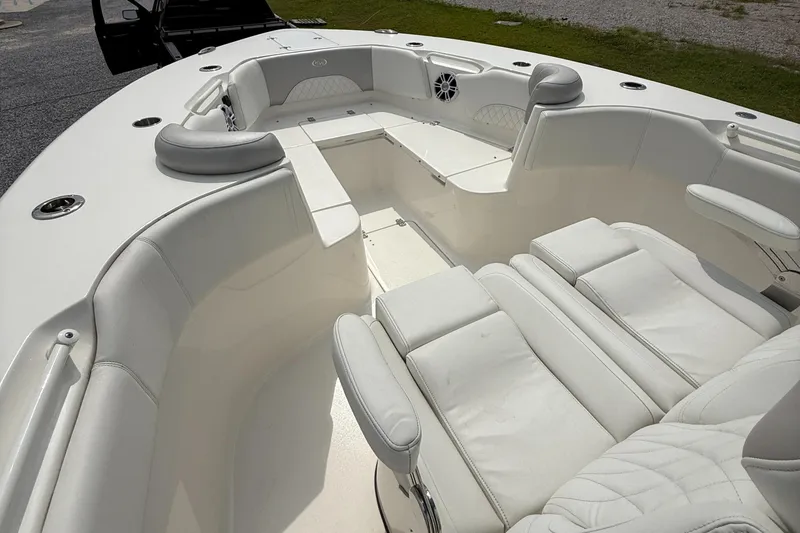 Slide: The Image of 2024 Key West 291 FS boat interior with white seating and spacious layout. - 13
