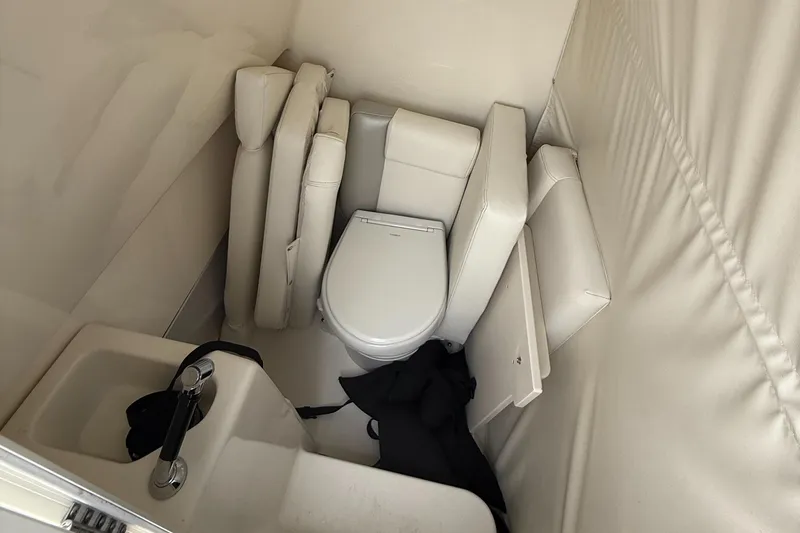 Slide: The Image of 2024 Key West 291 FS boat interior with toilet and sink. - 14