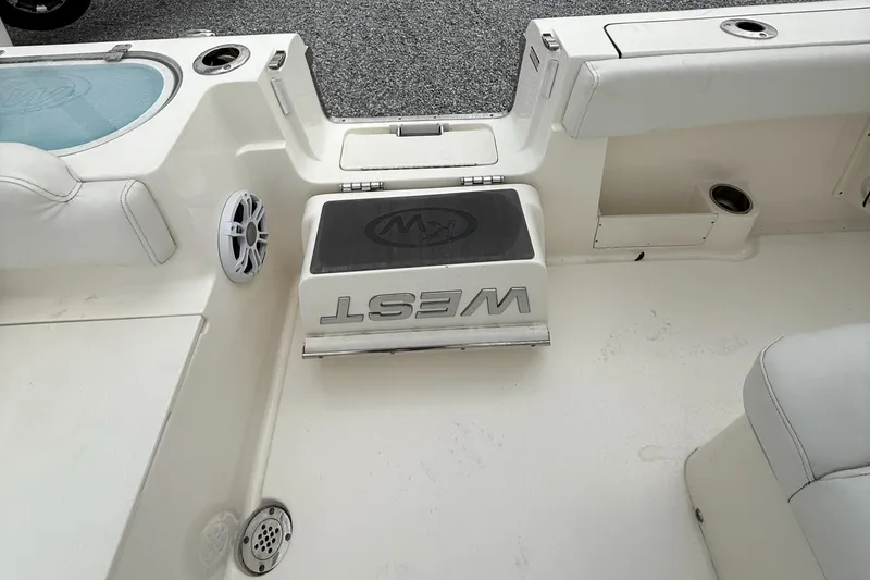 Slide: The Image of 2024 Key West 291 FS boat interior with seating and storage compartments. - 18