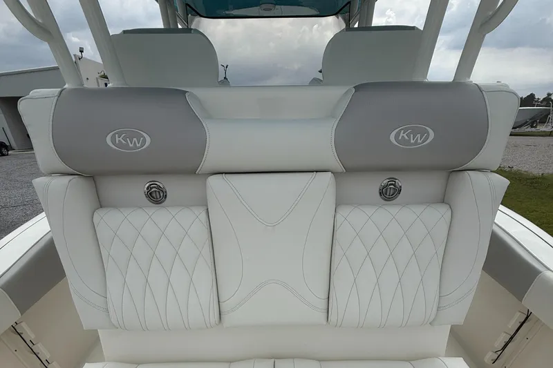 Slide: The Image of 2024 Key West 291 FS boat seating with elegant white and gray upholstery. - 19