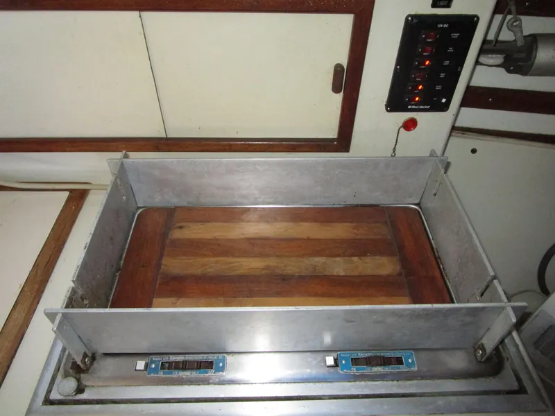 Slide: The Image of 1974 Irwin Competition 30 interior with wooden panel and control switches. - 10