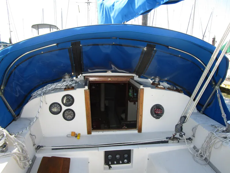 Slide: The Image of 1974 Irwin Competition 30 sailboat cockpit with blue canopy and instrument panel. - 2