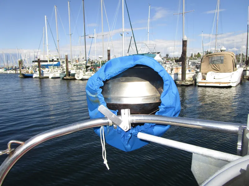 Slide: The Image of Sailboat helm with blue cover, Irwin Competition 30, 1974, docked in marina. - 4