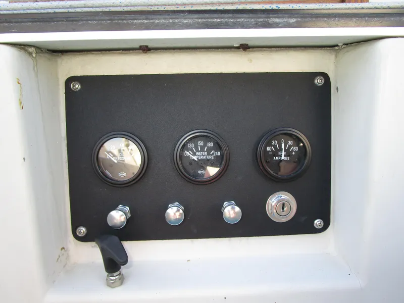 Slide: The Image of Control panel of a 1974 Irwin Competition 30 sailboat with gauges and switches. - 5