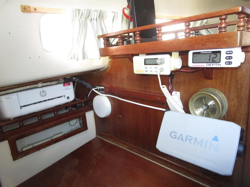 Slide: The Image of Interior of 1974 Irwin Competition 30 sailboat with navigation equipment and printer. - 9