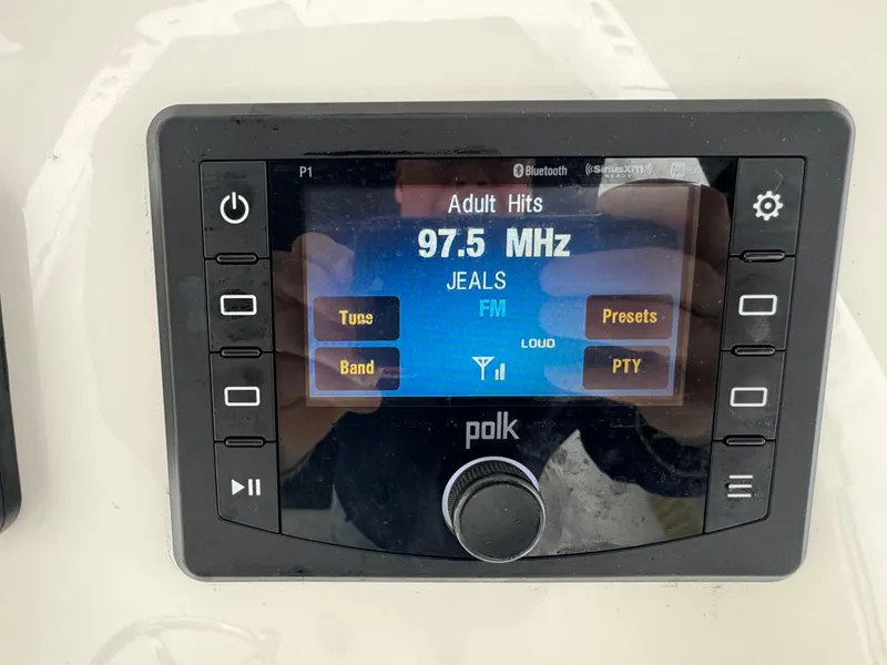 Slide: The Image of Polk audio system displaying 97.5 MHz FM station on Regulator 31, 2019 model. - 14