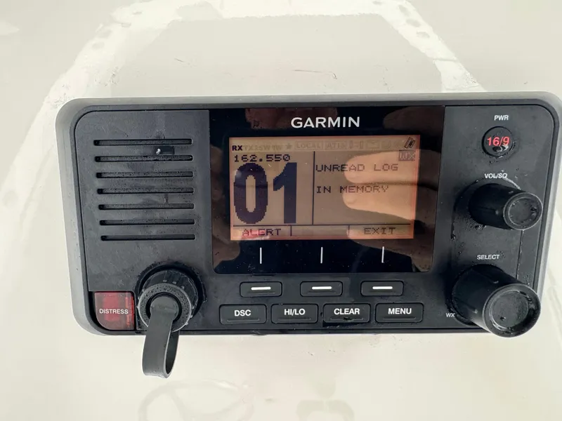 Slide: The Image of Garmin marine radio display on a 2019 Regulator 31 boat, showing alert message. - 15