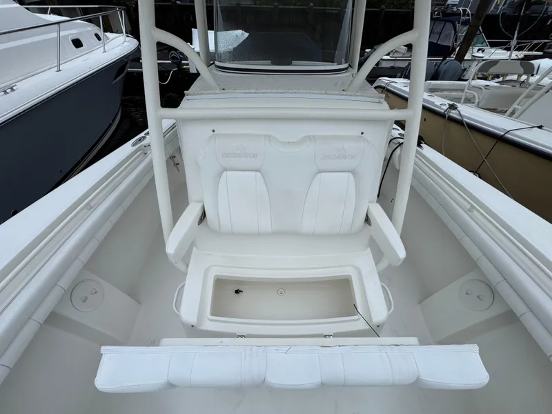 Slide: The Image of 2019 Regulator 31 boat interior with white seating and storage compartment. - 5