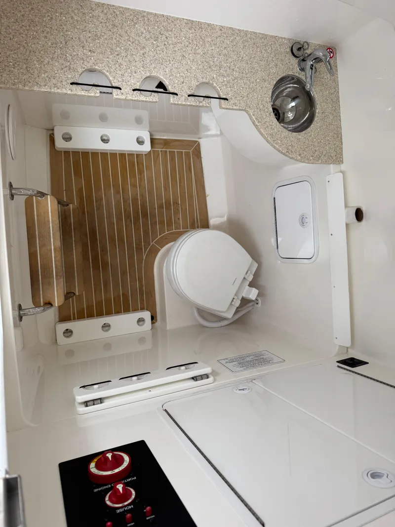 Slide: The Image of 2019 Regulator 31 boat interior with wooden flooring and modern amenities. - 6