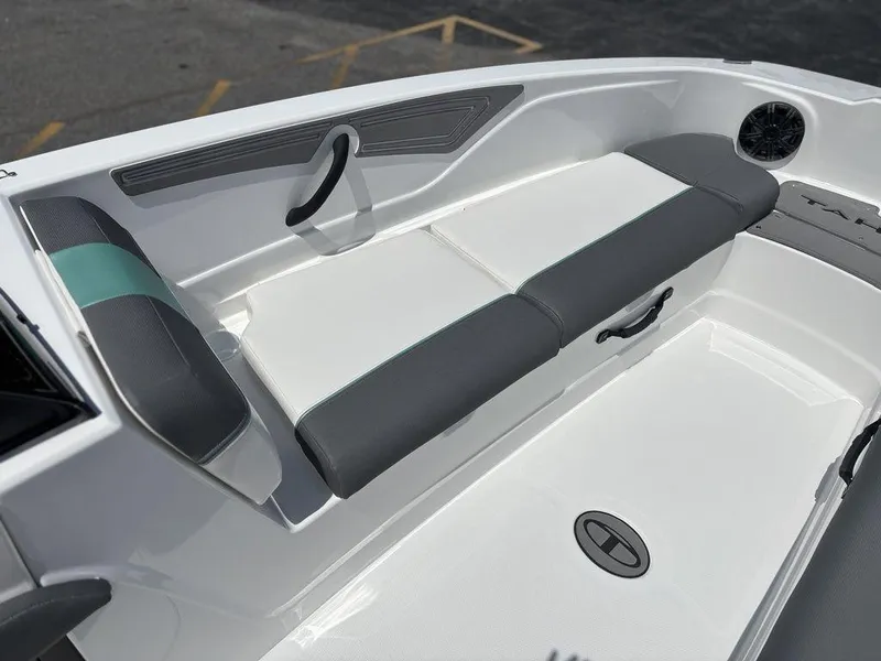 Slide: The Image of 2025 Tahoe T21 boat interior with gray and white seating, modern design. - 10
