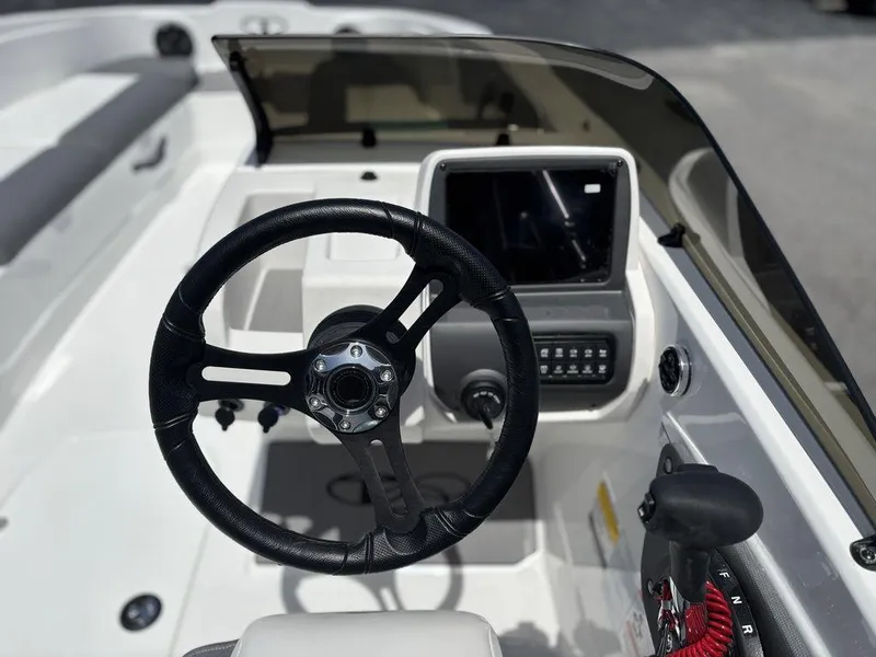 Slide: The Image of Steering console of 2025 Tahoe T21 boat with modern controls and dashboard. - 15