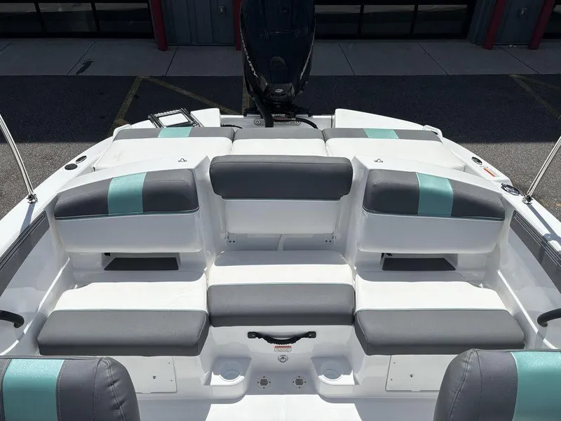 Slide: The Image of 2025 Tahoe T21 boat interior with gray and teal seating arrangement. - 20