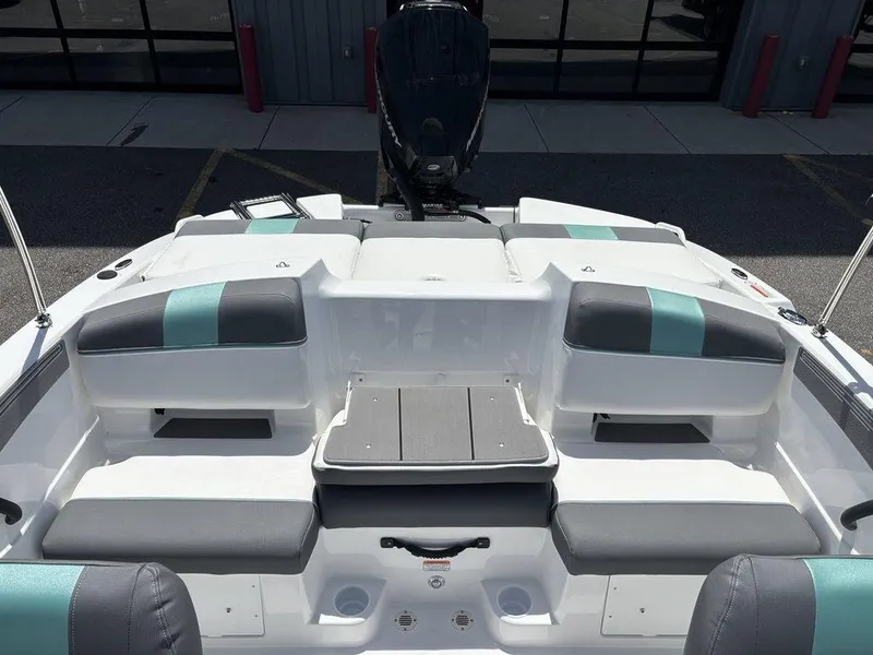 Slide: The Image of 2025 Tahoe T21 boat interior with gray and teal seating, modern design. - 21