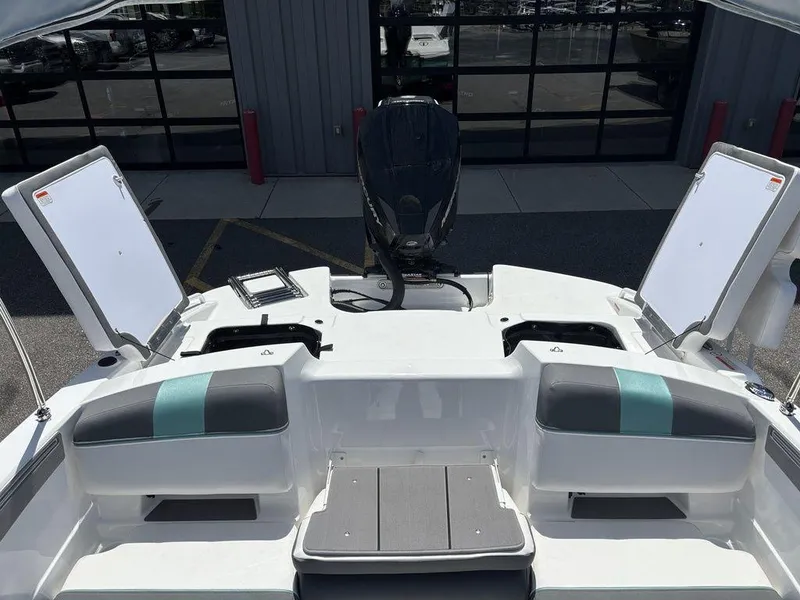 Slide: The Image of 2025 Tahoe T21 boat interior with seating and storage compartments. - 23