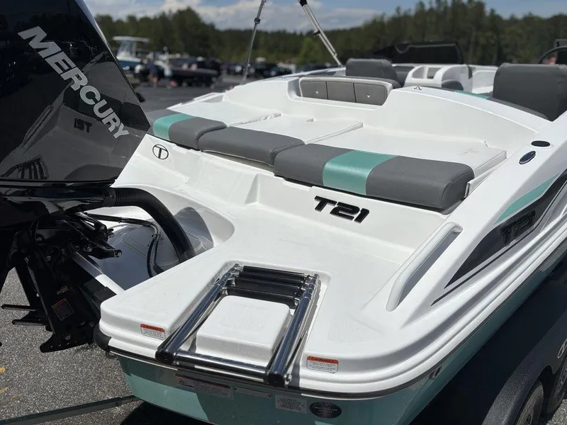Slide: The Image of 2025 Tahoe T21 boat with Mercury engine, featuring sleek design and comfortable seating. - 25