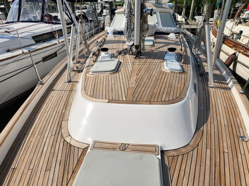Slide: The Image of Deck view of a 2006 Hallberg-Rassy 48 sailboat with teak wood finish. - 15