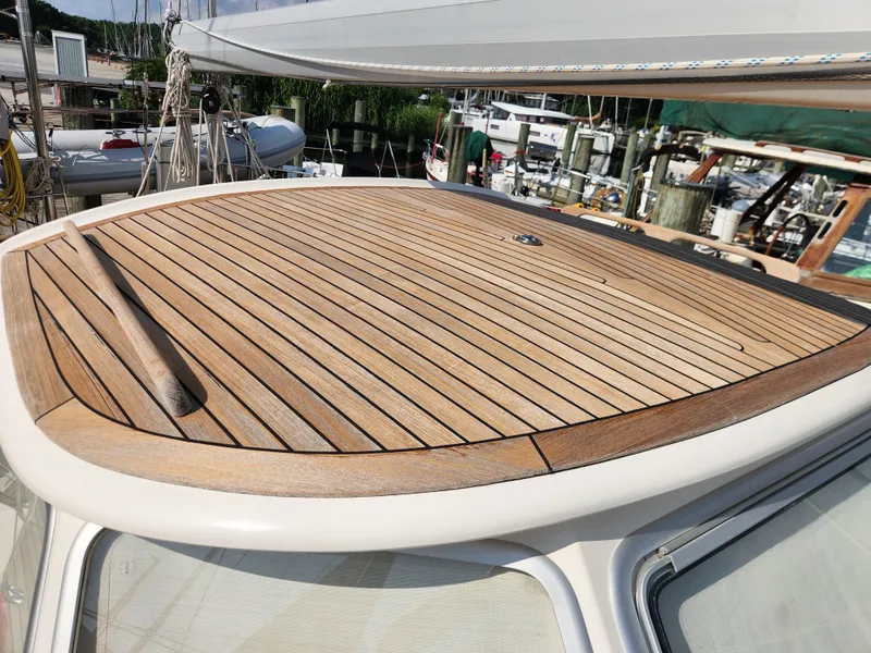 Slide: The Image of Teak deck of 2006 Hallberg-Rassy 48 sailboat, showcasing elegant craftsmanship. - 20