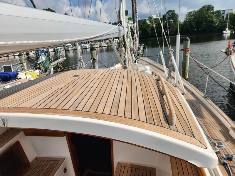 Slide: The Image of Hallberg-Rassy 48 sailboat deck, 2006 model, docked at a marina. - 23