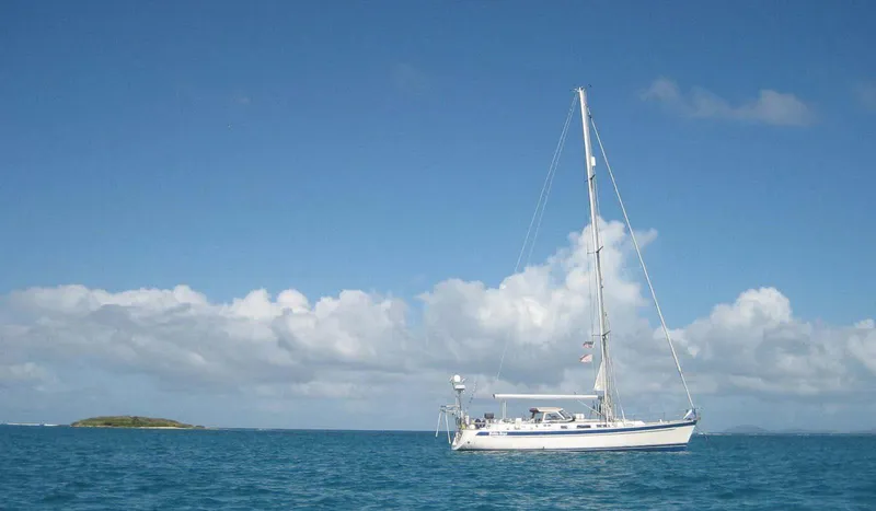 Slide: The Image of Sailing yacht Hallberg-Rassy 48 (2006) on calm blue sea under clear sky. - 3