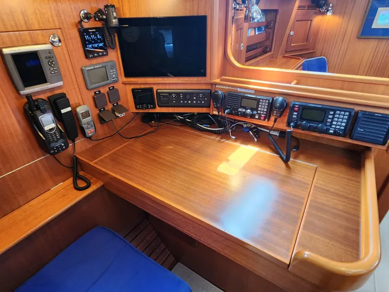 Slide: The Image of Navigation station of a 2006 Hallberg-Rassy 48 yacht with communication equipment. - 44