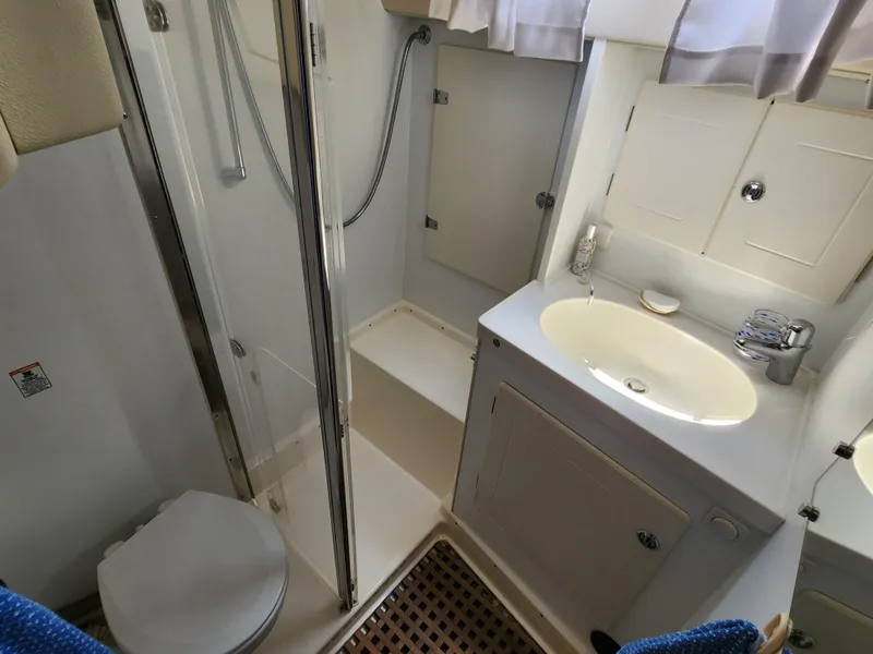 Slide: The Image of Bathroom interior of 2006 Hallberg-Rassy 48 yacht with shower, sink, and toilet. - 46