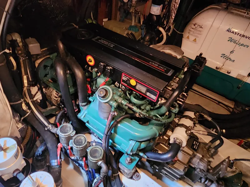 Slide: The Image of Engine room of a 2006 Hallberg-Rassy 48 yacht, featuring a detailed view of the engine. - 49