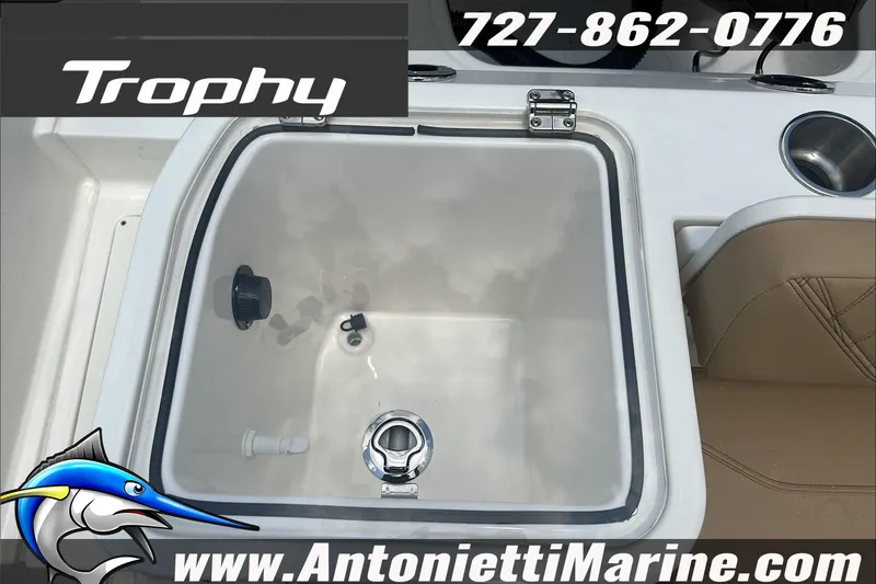 Slide: The Image of Trophy T24 CC 2025 boat interior with livewell and seating, Antonietti Marine contact details. - 12
