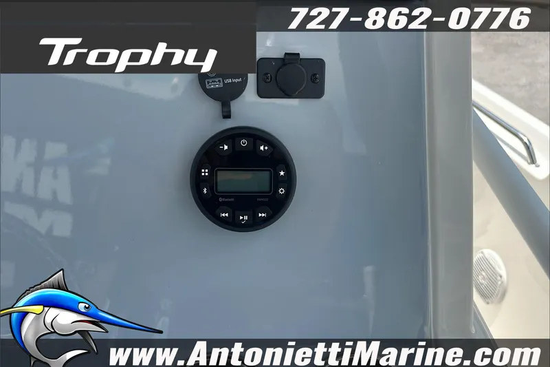 Slide: The Image of 2025 Trophy T24 CC boat dashboard with Bluetooth stereo and USB input. - 17
