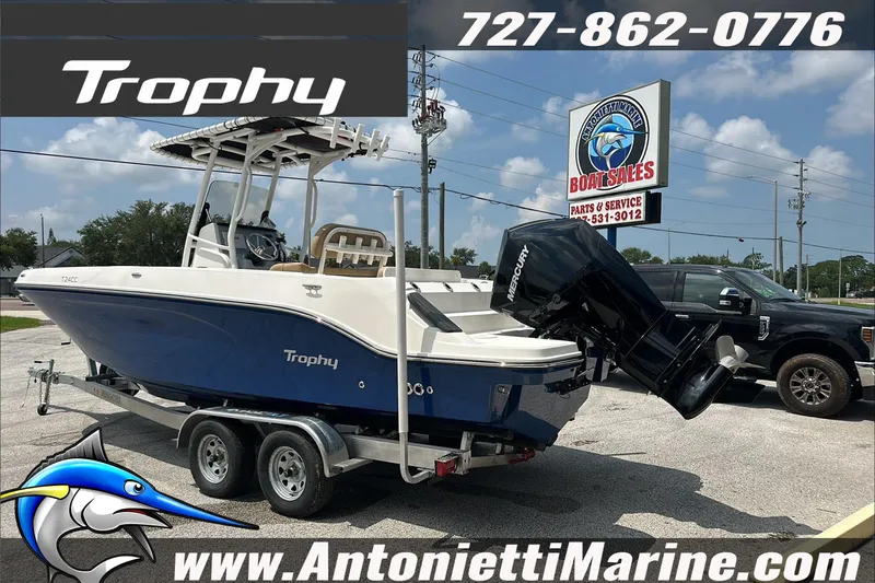 Slide: The Image of 2025 Trophy T24 CC boat on trailer at Antonietti Marine dealership. - 6