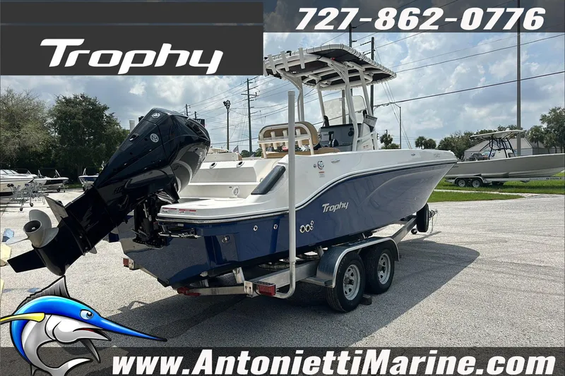 Slide: The Image of 2025 Trophy T24 CC boat on trailer at Antonietti Marine dealership. - 8