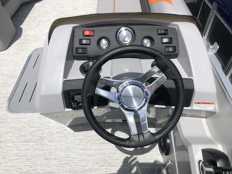 Slide: The Image of Steering console of 2025 Bennington SX L-Bench 22 SXL pontoon boat with modern controls. - 5