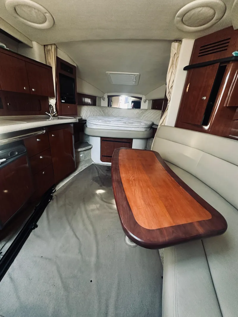 Slide: The Image of Interior of a 2006 Sea Ray 320 Sundancer yacht with elegant wood and leather finishes. - 22