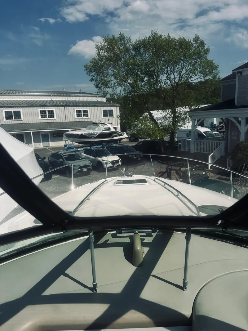Slide: The Image of 2006 Sea Ray 320 Sundancer boat docked at marina, view from helm. - 24